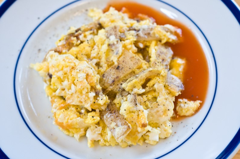 Serve chilaquiles with scrambled eggs